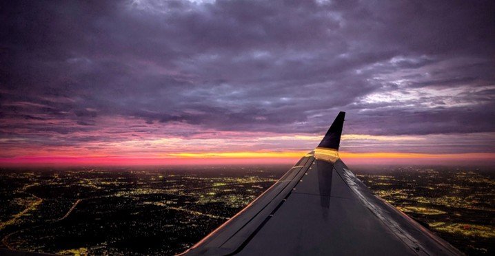 Airplane landing at sunset—Fuel up for the journey.